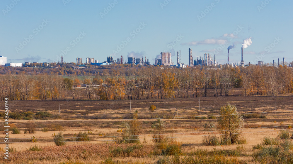 Autumn landscape with petrochemical processing plants 