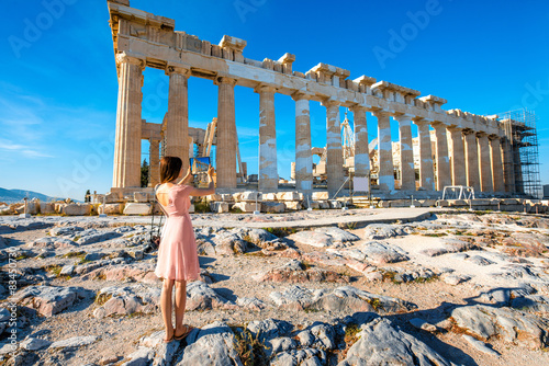 Woman photographing Parthenon temple in Acropolis