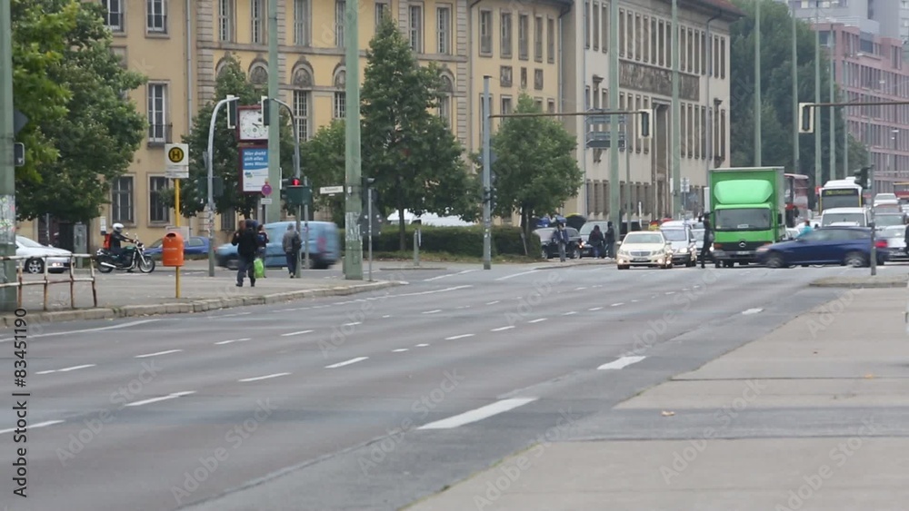 Vehicles waiting at traffic lights while other cars crossing Vehicles waiting at traffic lights while other cars crossing