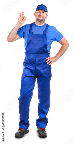 Worker in blue overalls.