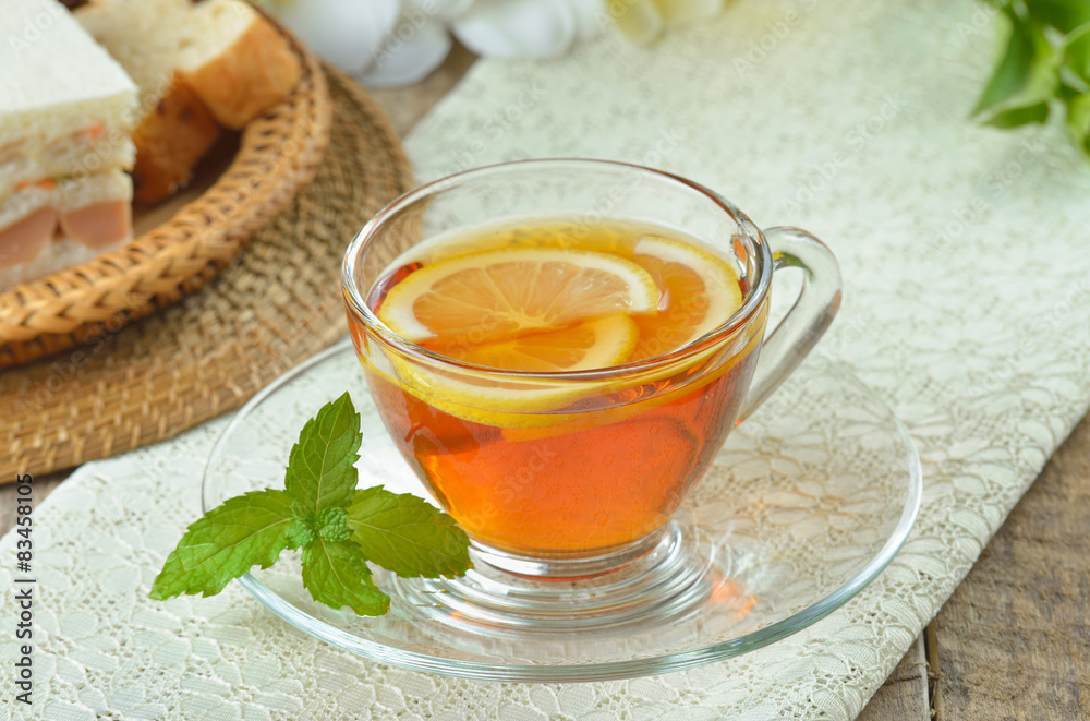 cups of tea with mint on wooden table cups of tea with mint on wooden table