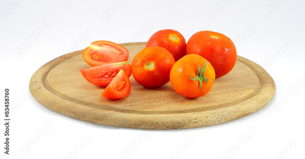 tomatoes on a cutting board wooden isolated on white background tomatoes on a cutting board wooden isolated on white background