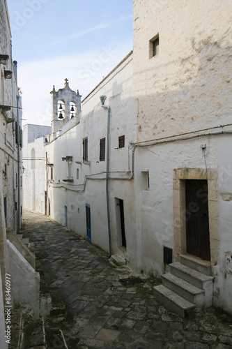 Narrow alley in the center of the medieval town Ostuni in Puglia © jorisvo