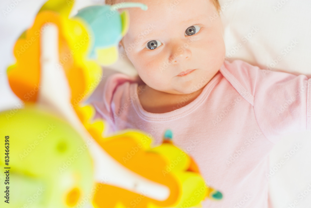 happy baby playing with children's musical mobile toy happy baby playing with children's musical mobile toy