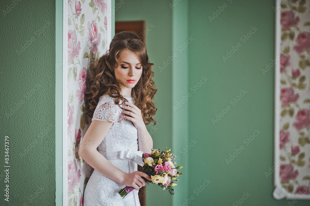 The girl in a white dress costs at a wall 2652. The girl in a white dress costs at a wall 2652.