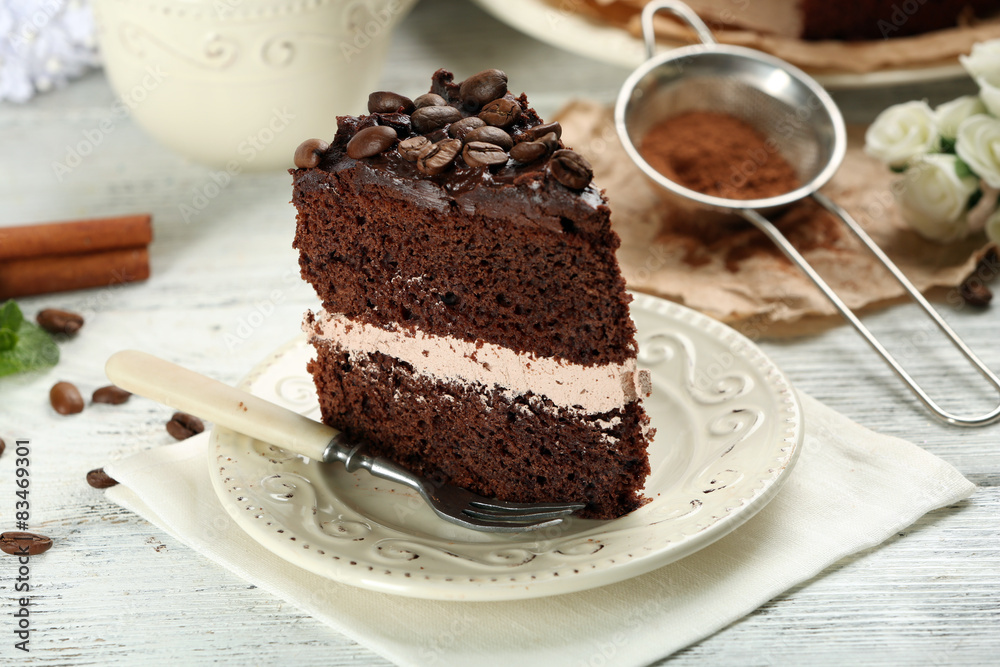 Delicious chocolate cake on table on brown background Delicious chocolate cake on table on brown background
