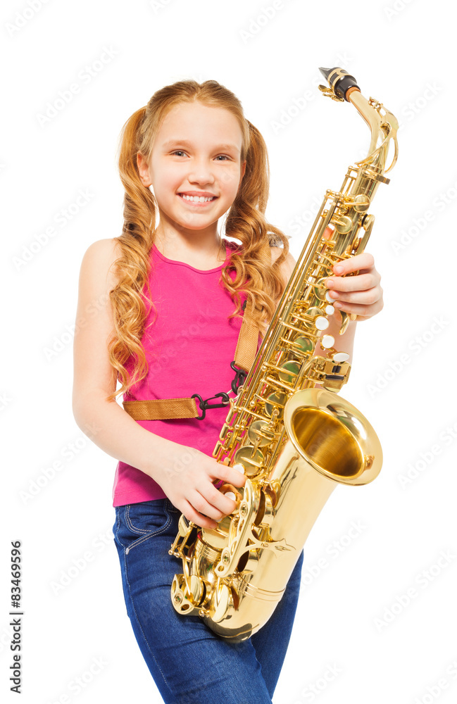 Fototapeta premium Close-up view of girl playing alto saxophone