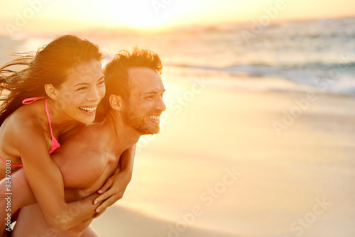 Lovers couple in love having fun on beach portrait