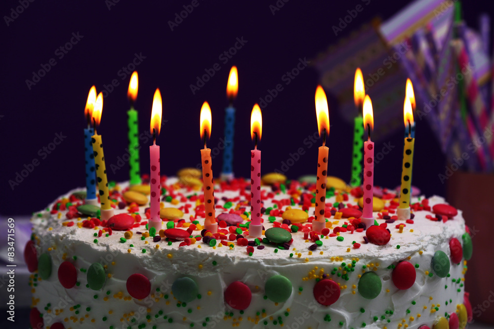 Birthday cake with candles on purple background Birthday cake with candles on purple background