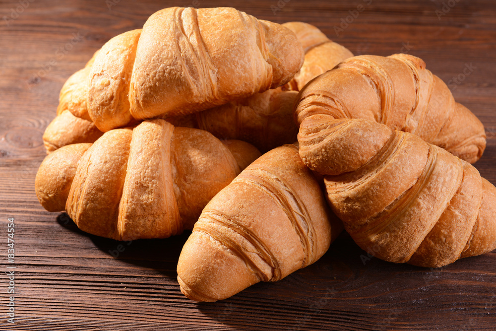 Delicious croissants on table close-up