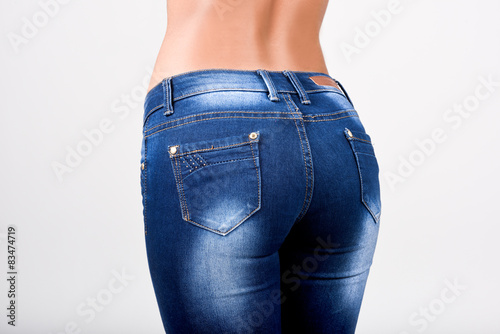 Woman wearing blue jeans with a beautiful waist