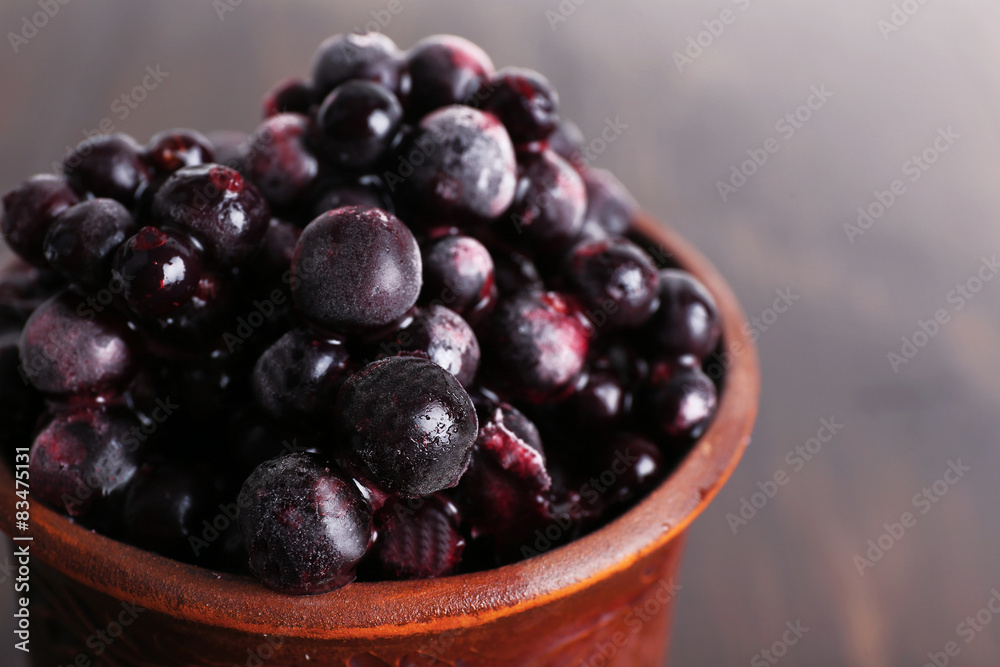 Cup of frozen currant berries, closeup Cup of frozen currant berries, closeup