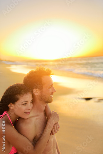 Happy romantic couple lovers on beach honeymoon © Maridav