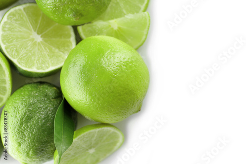 Sliced fresh limes isolated on white