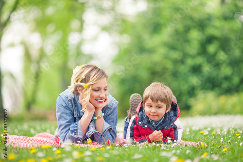 Young family enjoying spring while having a picnic in nature