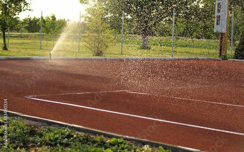 Tennis court watering