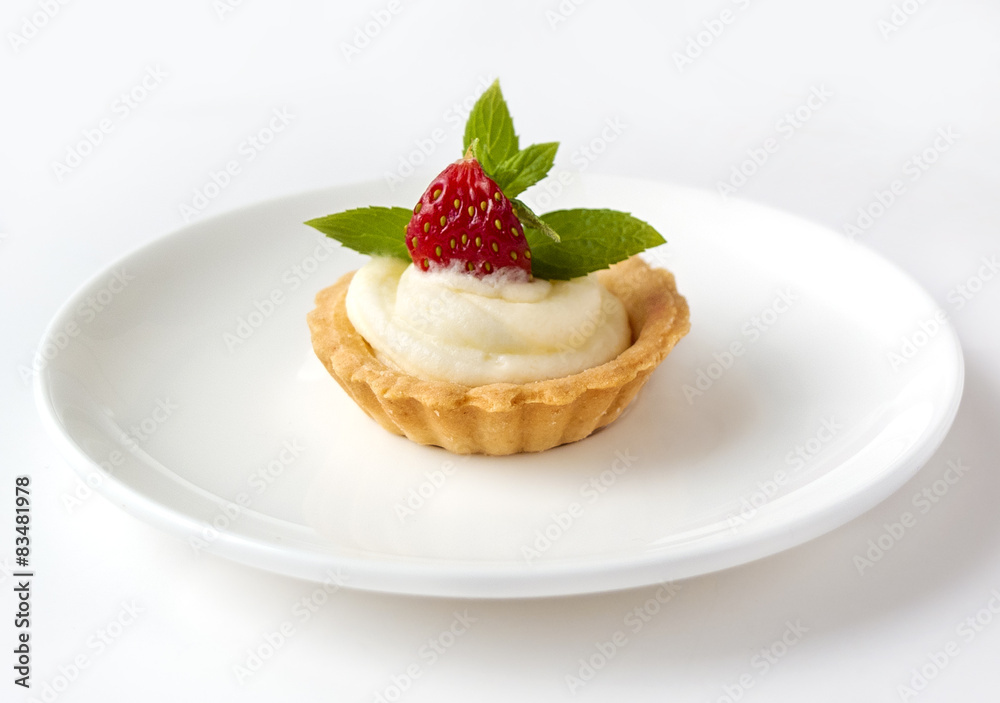 Tiny cupcake with strawberry, whipped cream and mint Tiny cupcake with strawberry, whipped cream and mint