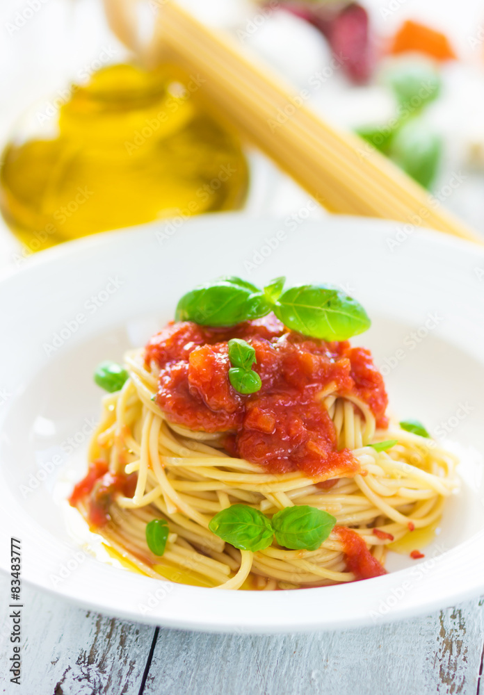 Spaghetti with tomato and basil leaves and chilli Spaghetti with tomato and basil leaves and chilli