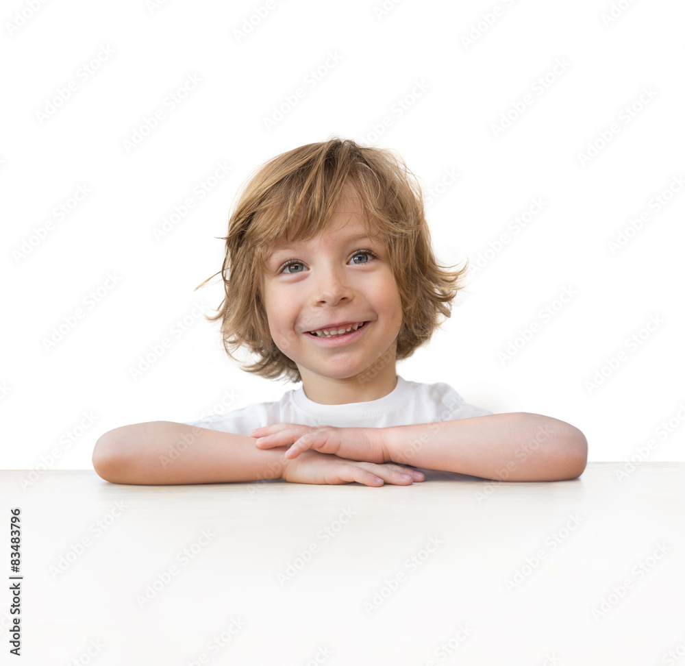 Adorable little boy on table edge isolated over white background Adorable little boy on table edge isolated over white background