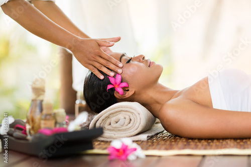 female getting recreation massage of head photo