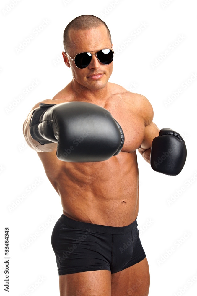 Muscular man in sunglasses with boxer gloves