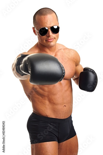 Muscular man in sunglasses with boxer gloves © petrdlouhy