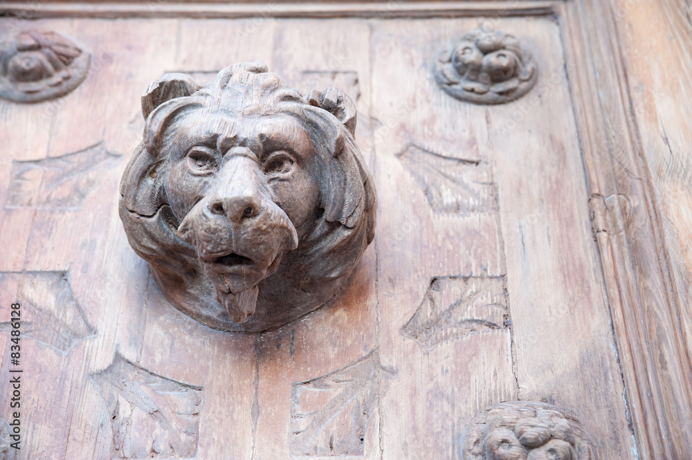 Wooden sculpture of a lion in a front door, Syracuse