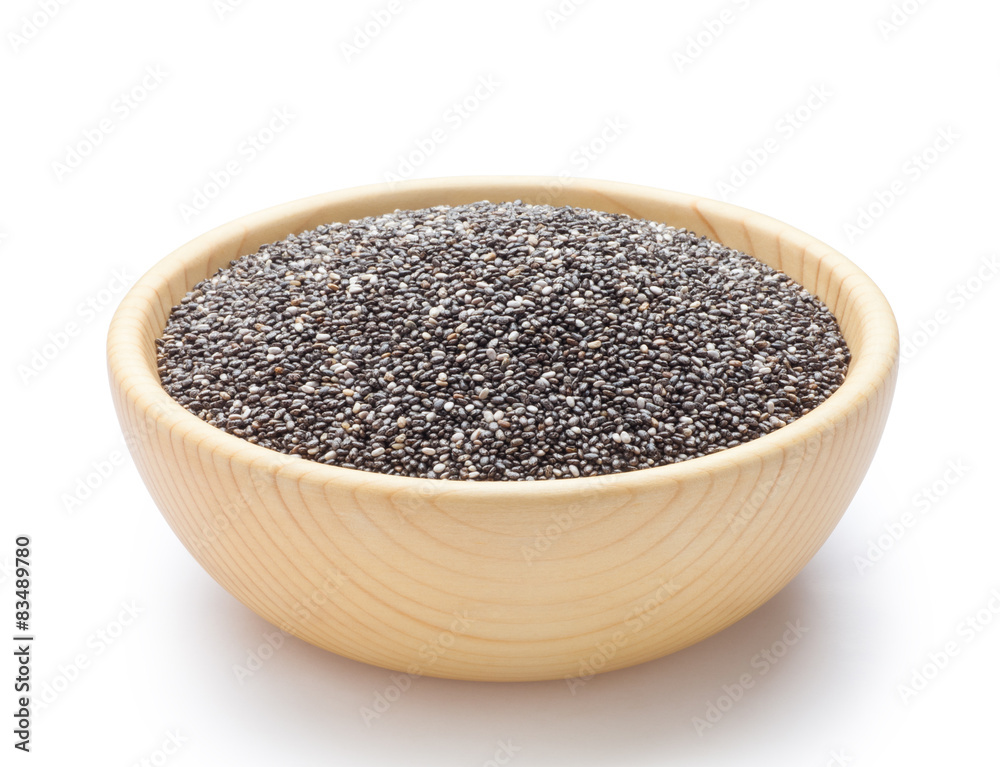 Chia seeds in wooden bowl Chia seeds in wooden bowl
