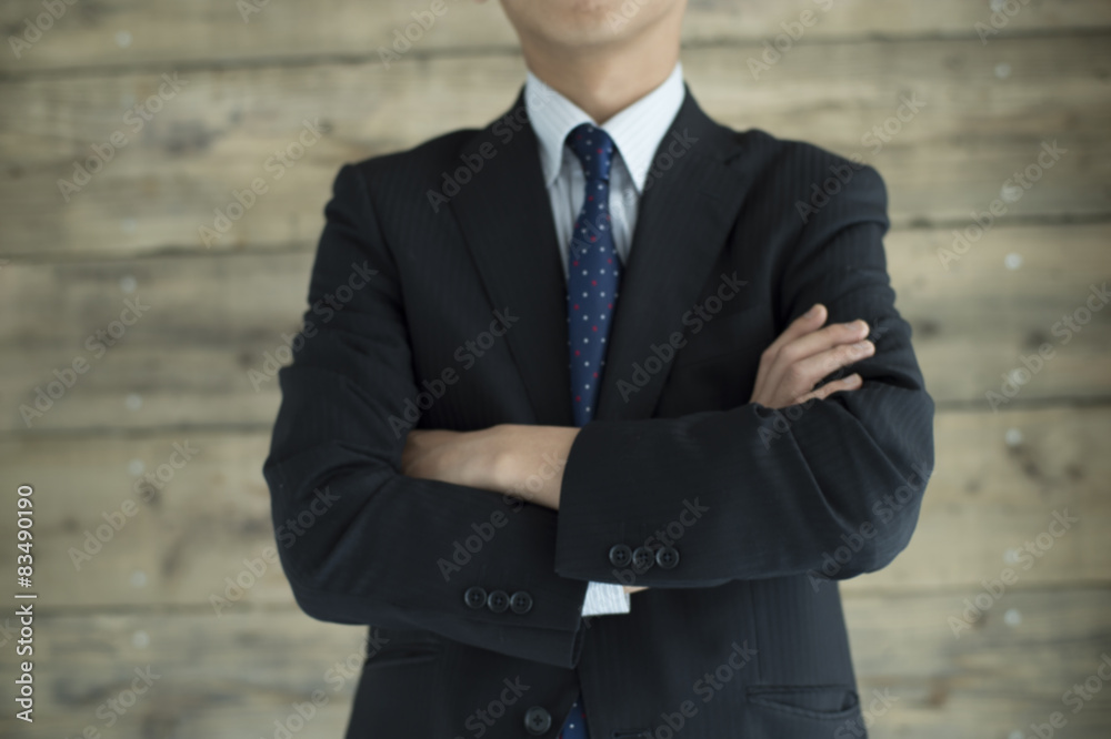 Businessman is standing with his arms folded Businessman is standing with his arms folded