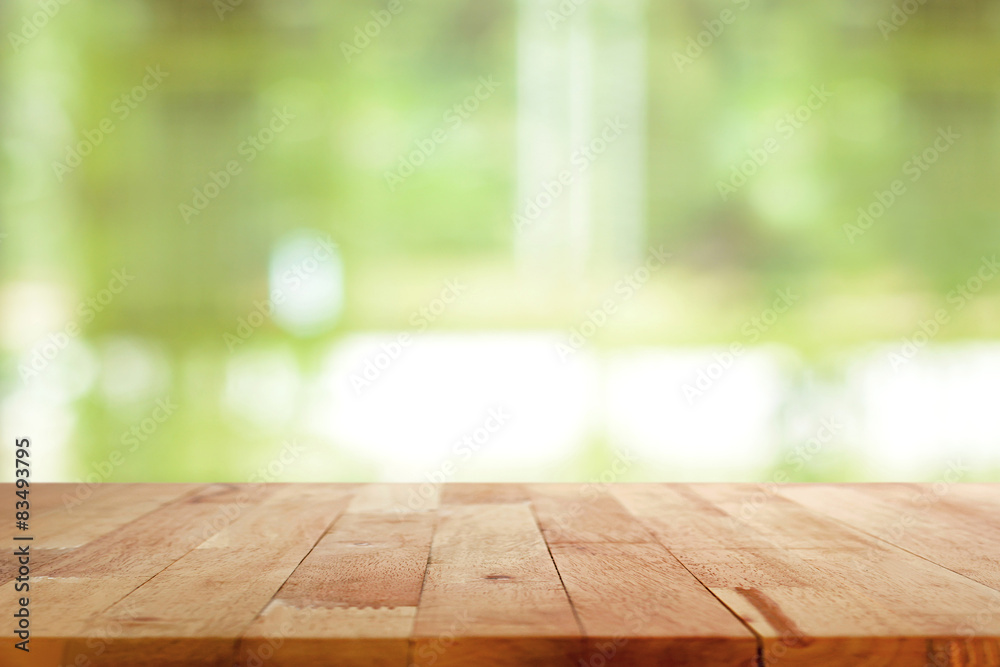 Wood table top on blurred green background