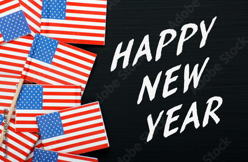 Happy New Year Message with USA flags on a blackboard
