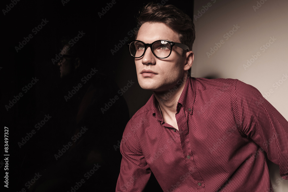 casual young business man looking up. casual young business man looking up.