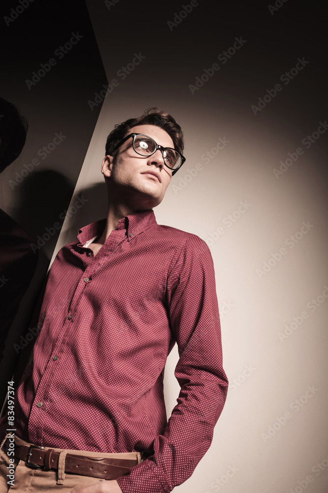 Angle view of a pensive young business man Angle view of a pensive young business man