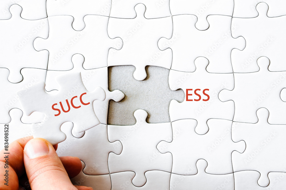 Missing jigsaw puzzle piece completing word SUCCESS
