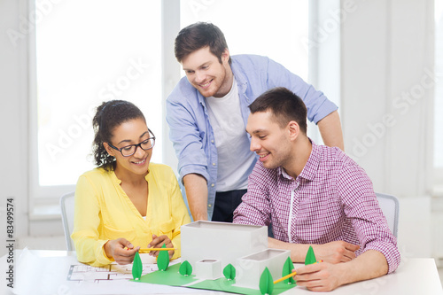 smiling architects working in office