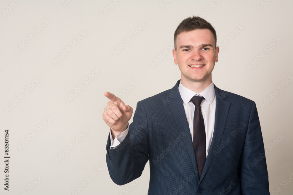 Businessman hand pushing screen on light background Businessman hand pushing screen on light background