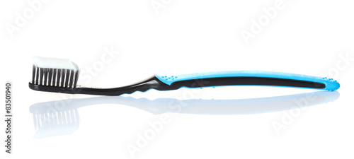 toothpaste on a toothbrush isolated on a white background