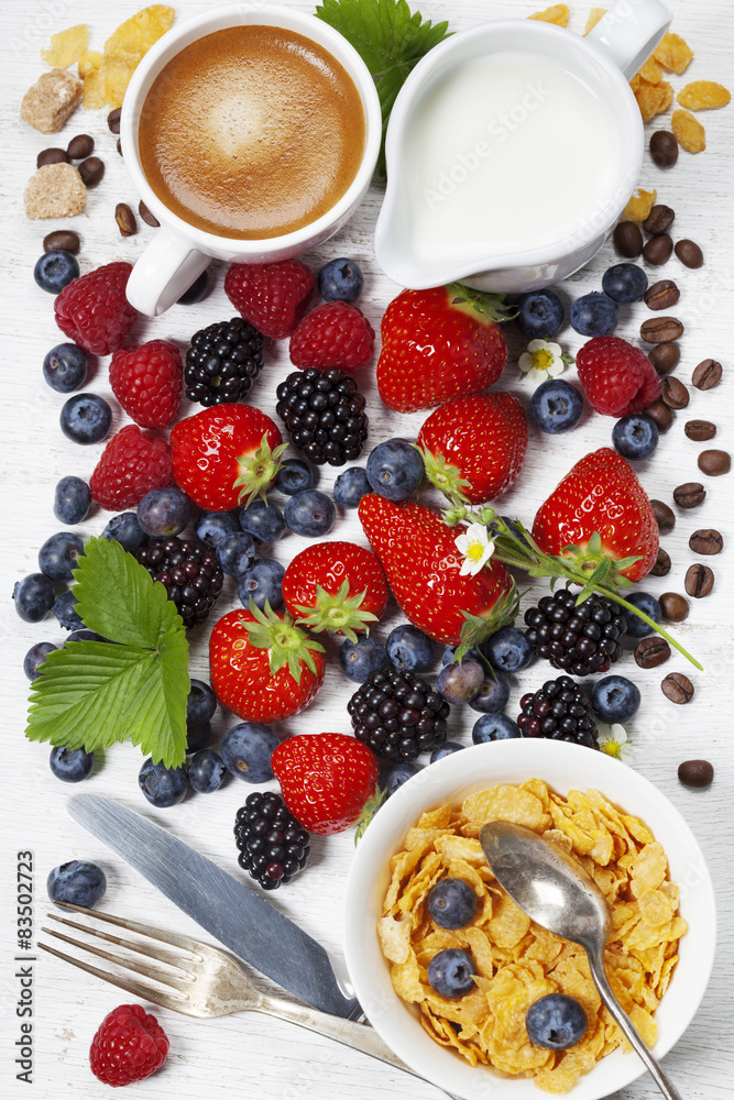 Breakfast with coffee, corn flakes, milk and berry Breakfast with coffee, corn flakes, milk and berry