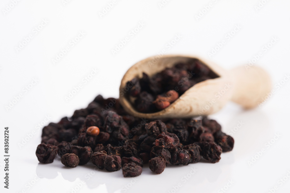Dried schisandra chinensis fruits isolated on white background Dried schisandra chinensis fruits isolated on white background