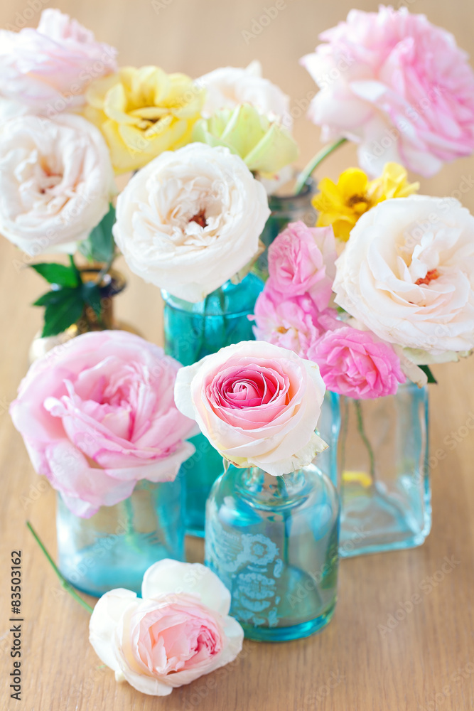 Floral composition with a roses on a table. Floral composition with a roses on a table.