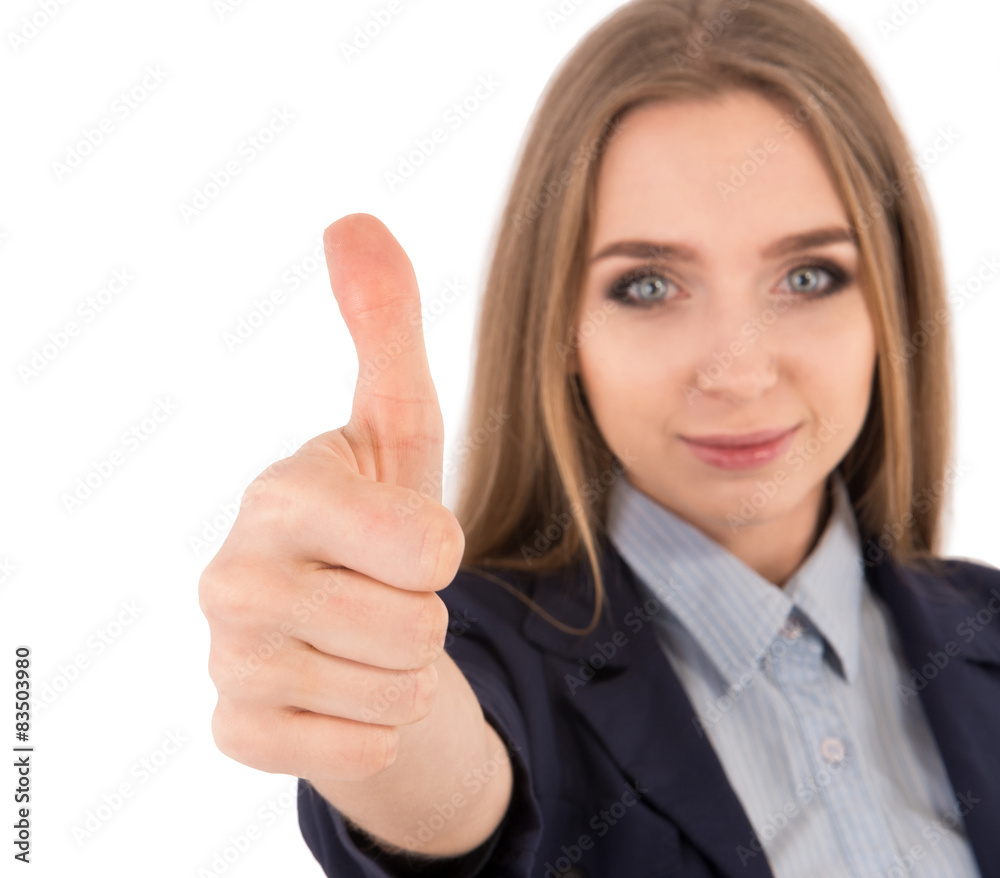 Well done! Beautiful young woman in formalwear showing her thumb Well done! Beautiful young woman in formalwear showing her thumb