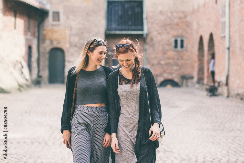 Two beautiful nordic girls visiting old fortress in Oslo