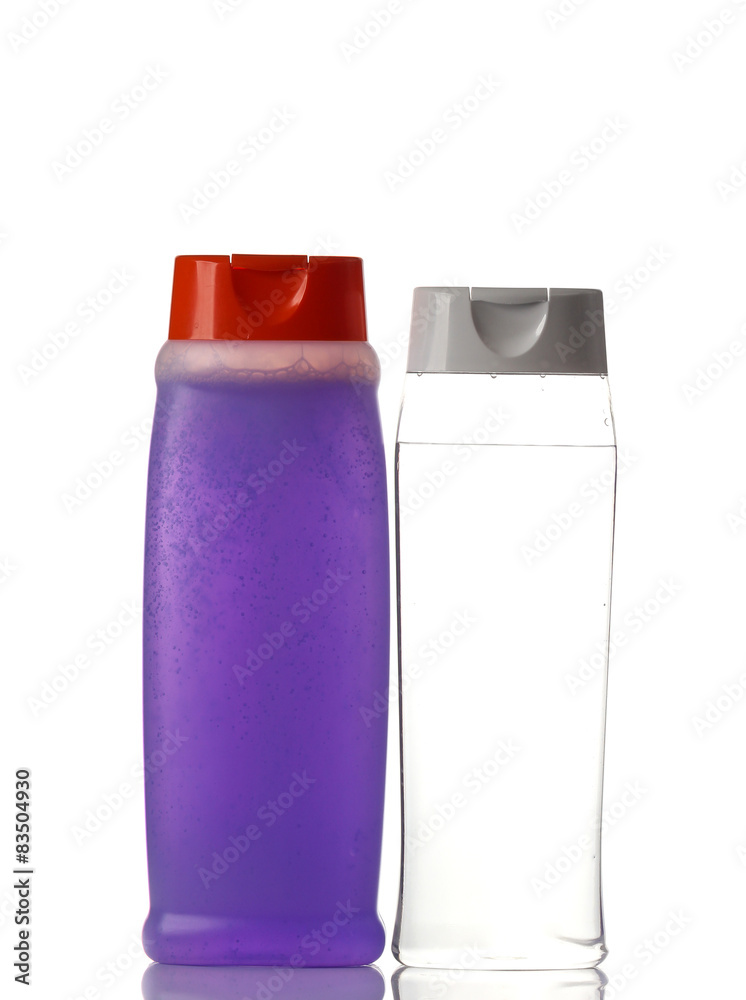  plastic bottles of body care and beauty products on white