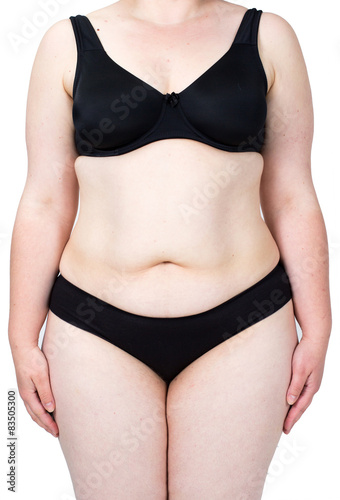 Obraz na płótnie Obese neglected body isolated over white background.
Woman showing her fat body. Healthy lifestyles concept.
w salonie