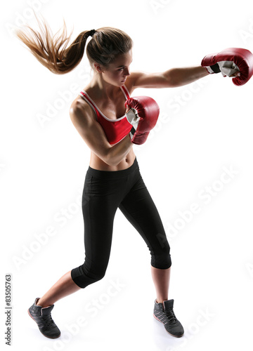 Female boxer punching wearing boxing gloves 