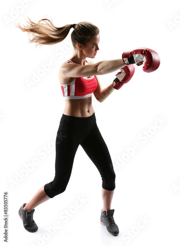 Boxing woman punching wearing boxing gloves © Romario Ien