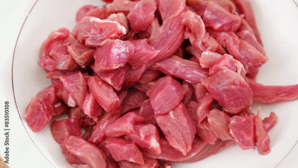 Beef chunks marinated in dark soy sauce; closeup Beef chunks marinated in dark soy sauce; closeup