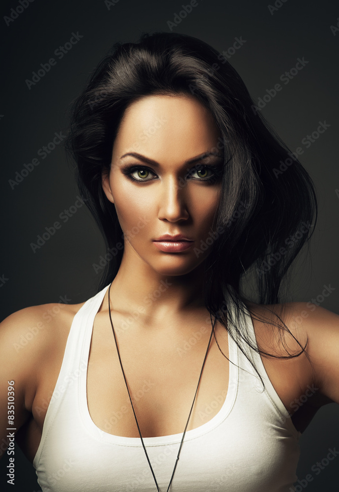 beautiful brunette woman in white top