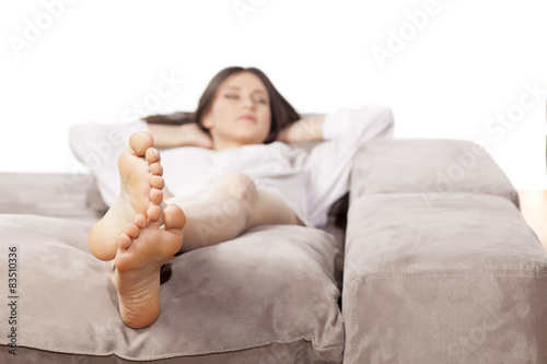 young woman lying on the couch and relax
