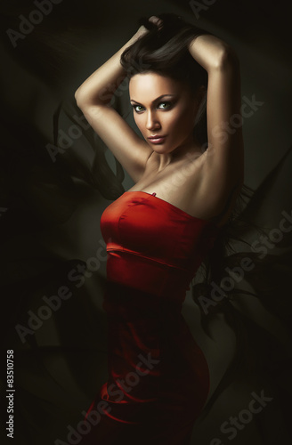 brunette woman in red dress